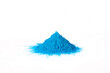 Closeup shot of a blue powder isolated on a white background