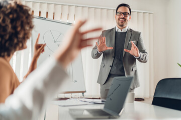 Businessman gesticulating with hands during his presentation speech