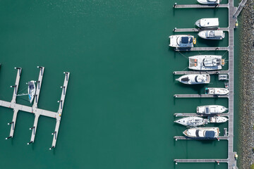 Wall Mural - Aerial overhead view of yachts moored at Boathaven beach, located in Airlie Beach in Queensland Australia