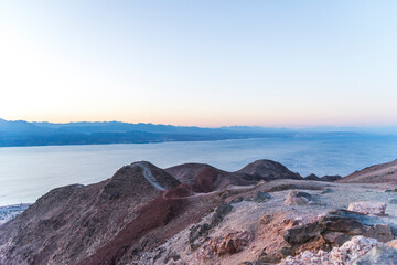 Wall Mural - Mountains in the desert against the backdrop of the Red Sea. Shlomo mountain, Eilat Israel, Mars like Landscape. High quality photo