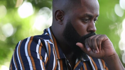 Wall Mural - Depressed African man feeling regret and problems