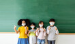 © JR-50 - Diversity of children students wearing medical masks in the classroom
