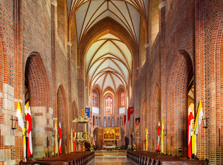 Wall Mural - Interior of St. Peter and St. Paul Archcathedral Basilica with main nave and altar on historic Ostrow Tumski island at Cybina river in Poznan, Poland