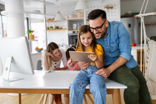 Online School, Technology, Family Concept. Happy Parents Helping To Children To Study At Home