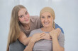 © Bangkok Click Studio - A young and beautiful daughter cuddles her mother's cancer patient and fortifies her to fight during the chemotherapy. Concept for love and support from beloved and family to breast cancer people