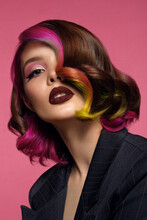 Beautiful Woman With Multi-colored Hair And Bright Make Up And Hairstyle.