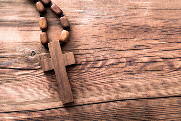 Wall Mural - wooden cross on the wooden table