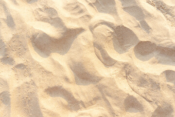 Wall Mural - Sand texture background on the beach. Light beige sea sand texture pattern.