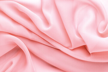 Wall Mural - light pink fabric draped with large folds, delicate textile background