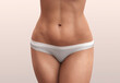 Abdominal press. Woman body beauty healthcare. Close up of female body in beige panties.