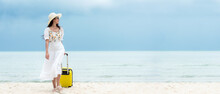 Summer Vacations. Lifestyle Woman Relax And Chill On Beach.  Asian Happy Young People Wearing White Dress Fashion And Holding Suitcase  In Summer Trips, Copy Space For Banner