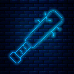 Poster - Glowing neon line Baseball bat with nails icon isolated on brick wall background. Violent weapon. Vector