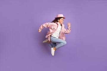 Wall Mural - Profile photo of little lady jump run empty space wear pink hat plaid jacket jeans shoes isolated violet color background