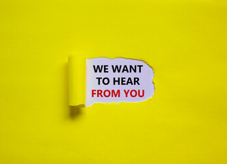 Wall Mural - Support symbol. Concept words 'we want to hear from you' appearing behind torn yellow paper. Beautiful yellow background. Business and support concept.