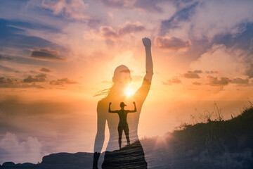Strong confident woman on mountain top flexing arms facing the sunset. People feeling inspire, and finding inner strength concept. double exposure.	