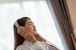 © surachetkhamsuk - Young Asian woman enjoy listening to music with headphones, happy and relaxing time
