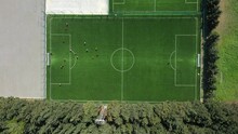 Aerial View Of Players Playing At Green Soccer Field In Tbilisi, Georgia.