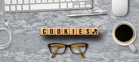 Dice with Cookie icons and a laptop keyboard conceptual of the GDPR regulations introduced by the EU governing data collection and privacy of information for individuals online.