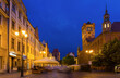Night view of lighted central Torun square with Old Town Hall and statue of Copernicus, Poland