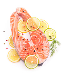 Poster - Steak of red fish and sliced lemons on white.