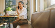 © Jacob Lund - Businesswoman talking on phone and taking notes