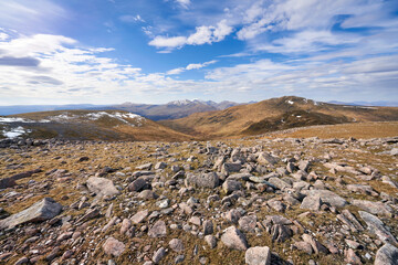 Poster - The mountain summit of Carn Gorm to the right with distant views of An Stuc, Ben Lawers and Beinn Ghlas from Meall Garbh in the winter. Scottish Highlands, UK Landscapes.