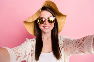 Sticker - Photo of adorable young girl make selfie beaming smile wear cap isolated on pastel pink color background