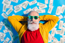 High Angle View Photo Of Happy Good Mood Positive Grandfather In Sunglass Lying Floor With Money Isolated On Blue Color Background