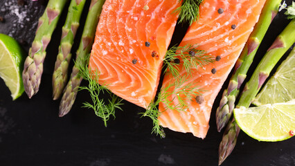 Wall Mural - raw salmon fillet with lemon and asparagus