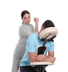 Canvas Print - Man receiving massage in modern chair on white background