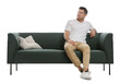 © New Africa - Man relaxing on comfortable green sofa against white background