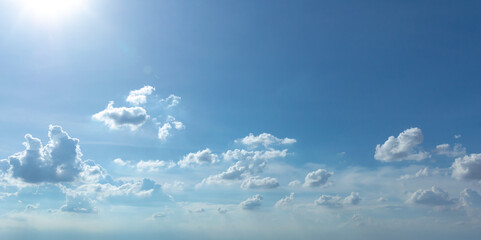 blue sky background with tiny clouds. panorama white fluffy clouds in the blue sky.Beautiful vast blue sky with amazing cloud background.Wide sky panorama with scattered cumulus clouds.