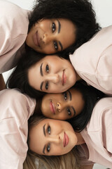 Wall Mural - group of different ethnicity women. multicultural diversity and friendship.