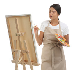 Wall Mural - Young woman drawing on easel against white background