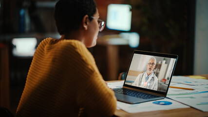 Aufkleber - Beautiful Multiethnic Latina Manager is Making Video Call to His Doctor on Laptop in a Creative Office Environment. Man is Talking to His Medical Consultant Over a Live Camera, Asking about Health.