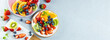 © Kseniya - Web banner with fresh summer salad of various fruits and berries. Kiwi, orange, strawberry and blueberry on a plate decorated with mint on a table top view, free space for text