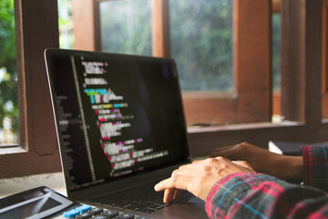 Wall Mural - close up, hand typing on a keyboard, developer programming and coding technology. website design saf