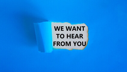 Wall Mural - Support symbol. Concept words 'we want to hear from you' appearing behind torn blue paper. Beautiful blue background. Business and support concept.
