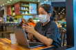 © Quang - Woman wearing protective mask to prevent Covid-19 infection