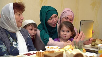 Wall Mural - Ramadan - Virtual Iftar feast. Eid-ul-Fitr: Video-conferencing iftaar, online gifts and other ways to celebrate the festival amid coronavirus lockdown