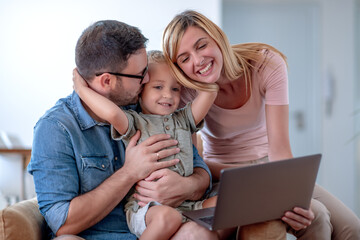 Poster - Family using laptop at home