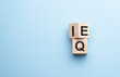 wood cube the expression IQ Intelligence Quotient to EQ Emotional Intelligence Quotient