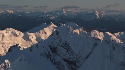 Wall Mural - 4k aerial dramatic mountains winter sunset