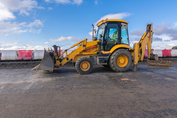 Wall Mural - Paving the ground at road construction works with a bulldozer