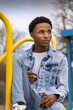 Portrait of a Young Male African American Teen Model Outdoors at the Park