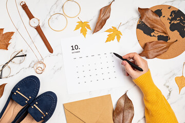 Wall Mural - Flat lay with calendar for october with woman fashion fall accessories.