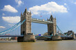 © Erica Ruth - Tower Bridge over Thames with blue sky and clouds, London, England