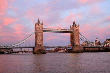 Tower Bridge over Thames with pink and blue sky at dusk, London, England