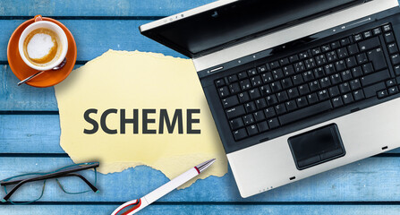 Scheme Programming Language. Word Scheme on paper and laptop
