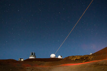 Laser Light Aiming To Cosmos From Mauna Kea Observatory During The Night,  Big Island, Hawaii